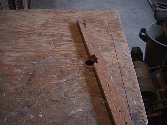 Photo of router table with a fence attached.