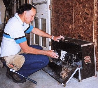 Dave getting a tool from his toolbox.