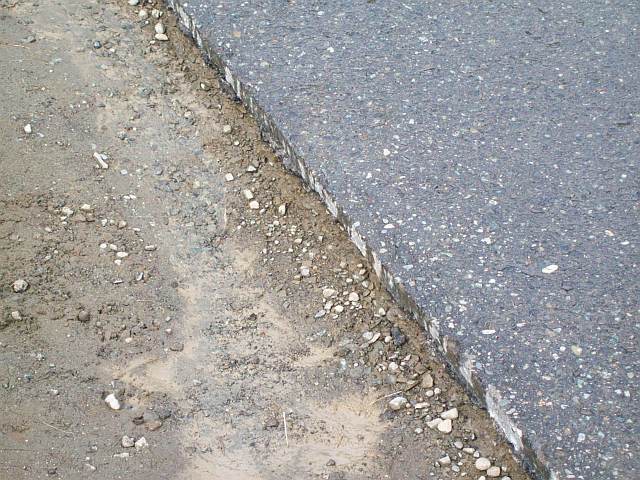 Photo of the edge of Daves driveway before the concrete curb was formed and poured.